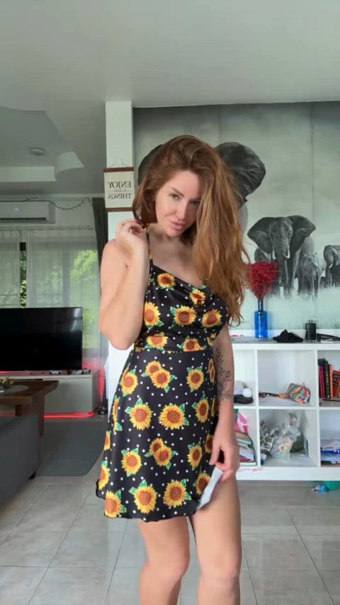 Red-haired beauty in a cute dress