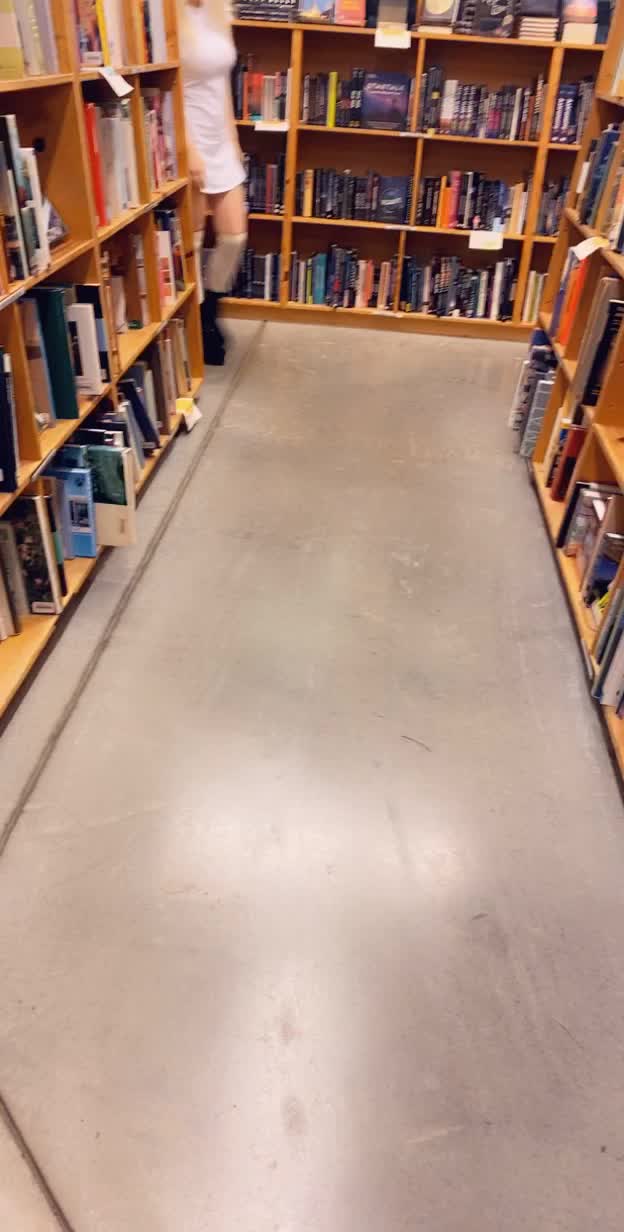 Busty petite at the bookstore