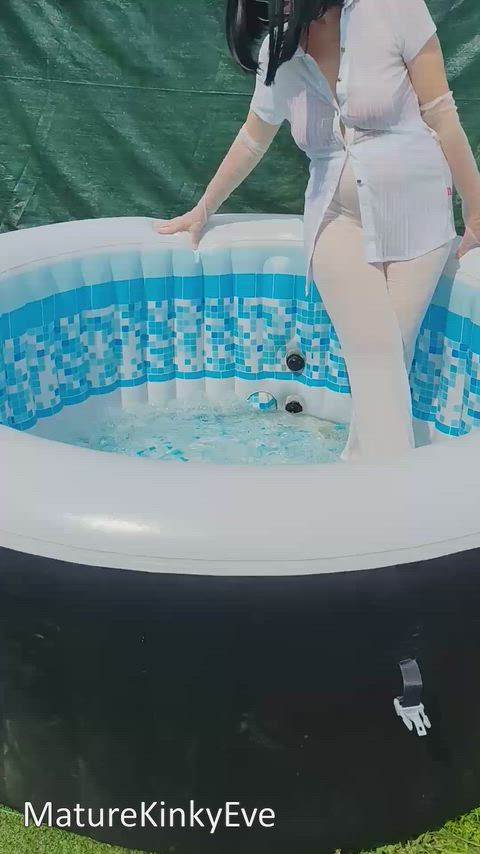 Dressed in wet transparent in the jacuzzi