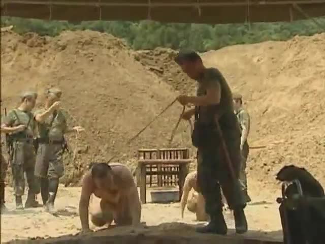 Unlucky prisoner gets punished by the sergeant.