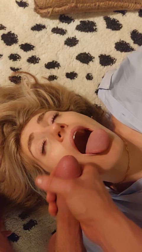 The hottest girl having her face covered in thick cum