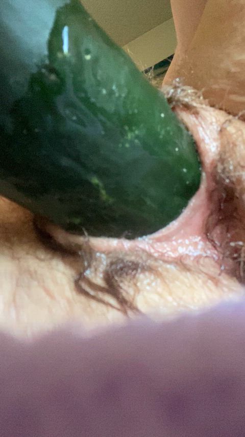 Stretching my pussy with the biggest cucumber I could find at the store