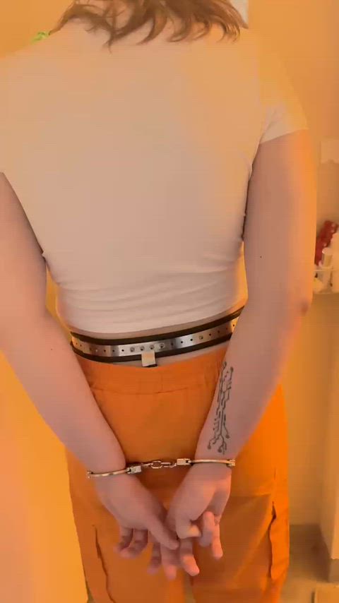 Cuffed cutie gets cleaned before lock up