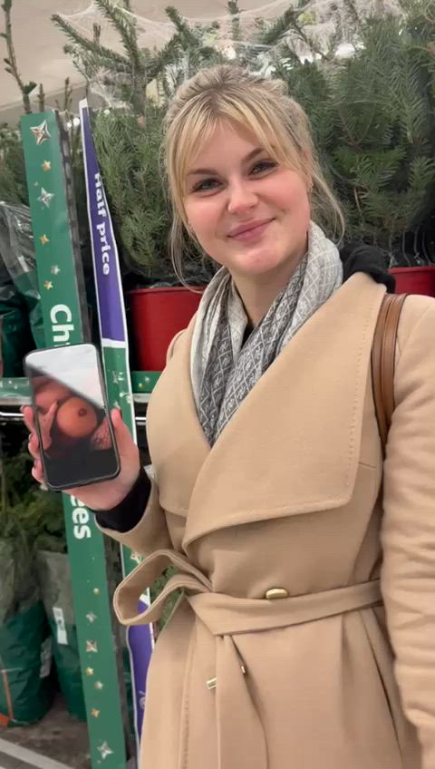 Showing off pictures of myself in the middle of a shop