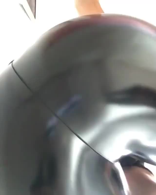 Shiny leggings facesitting