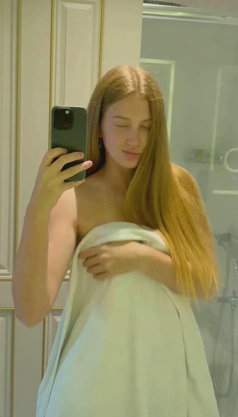 I'm totally turned on, feeling my clit throb while wrapped in a towel