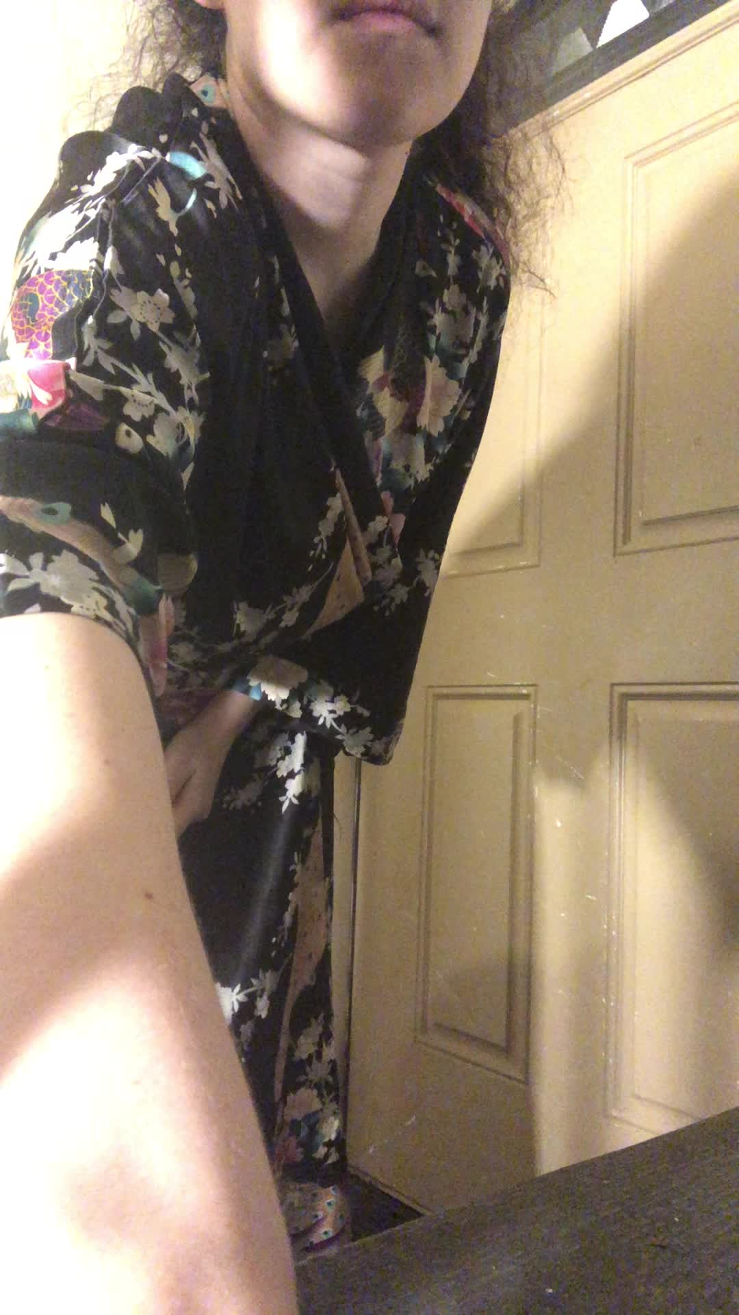 Unrobing in front of the back door of my apartment building