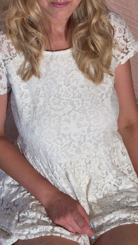 Lifting the white dress so you can see the rest thumbnail