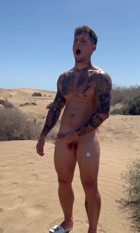 Tatted dude jerking around in the great outdoors.