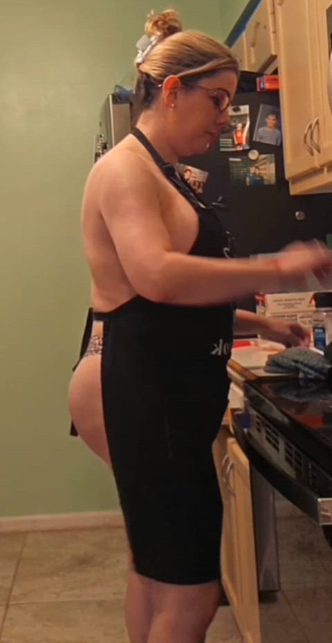 Busty hotwife cooking in high heels