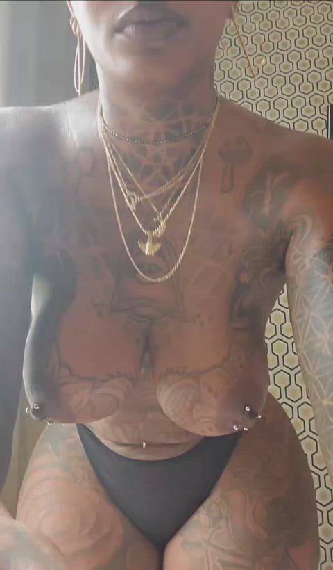 Ebony tattooed big tits