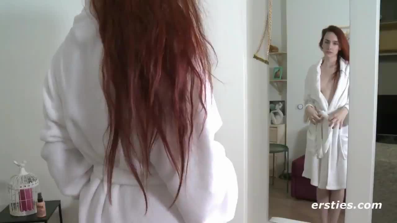 Claudia disrobing.