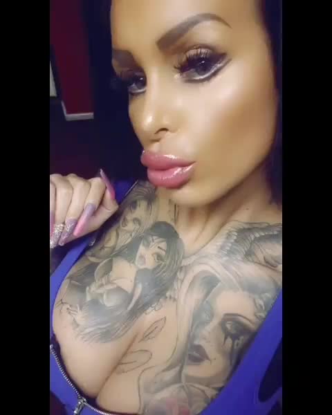 Showing off her plastic pout