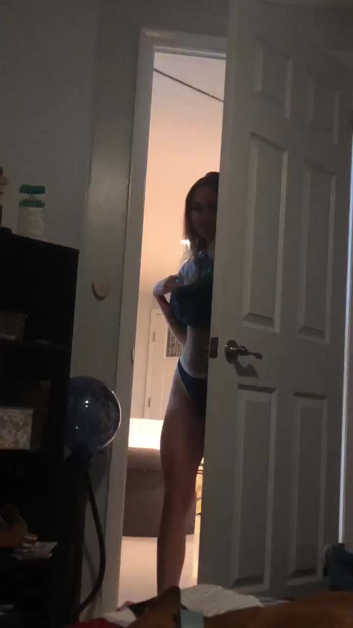 Entering the Room and Pulling off her Top