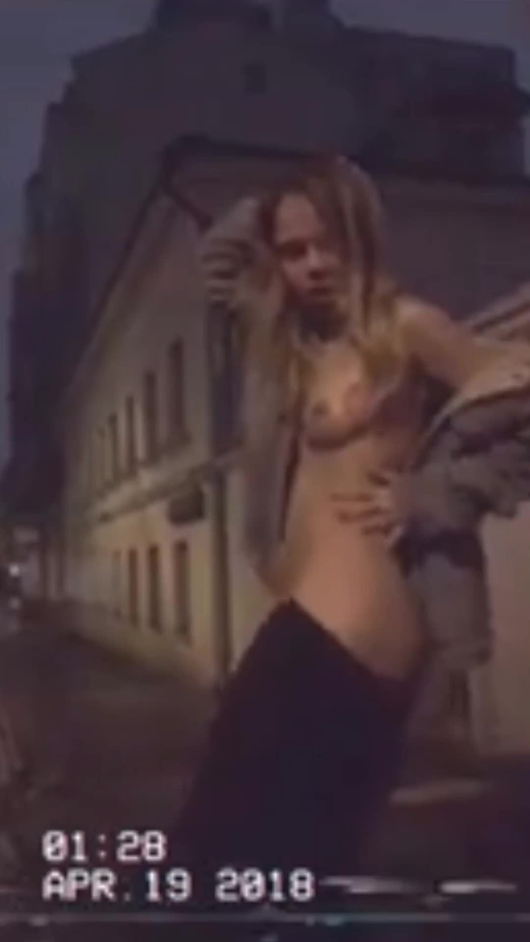Alexandra flashing and dancing outside