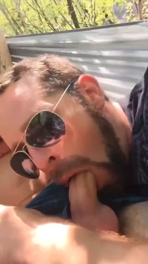 sucking cock while relaxing outside