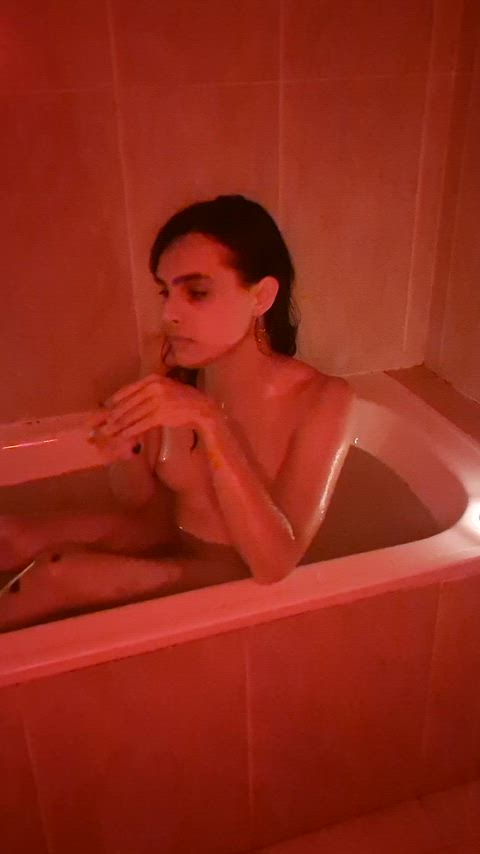 Beneath red light, your silhouette lingers in water