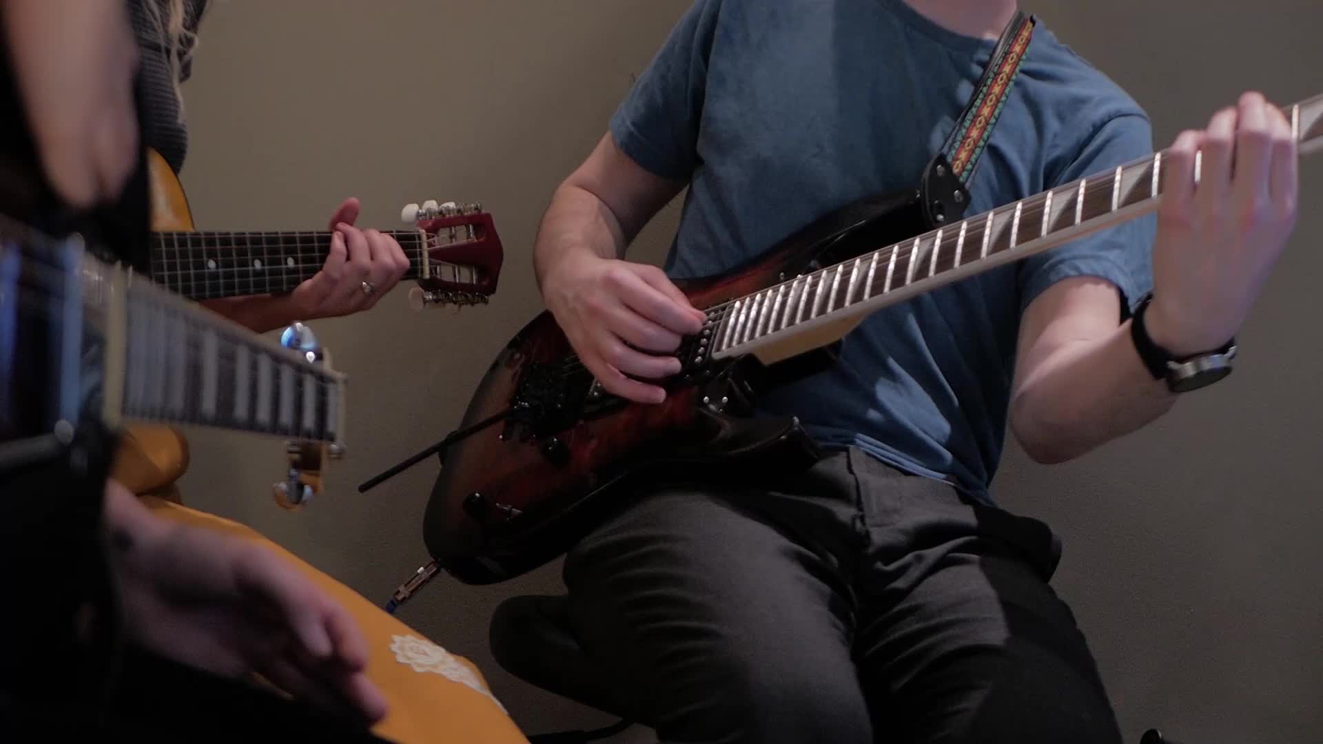 Guitar teacher has a bit of a wardrobe malfunction in front of students