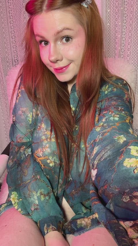 A robe, red hair, and a quiet fantasy moment..