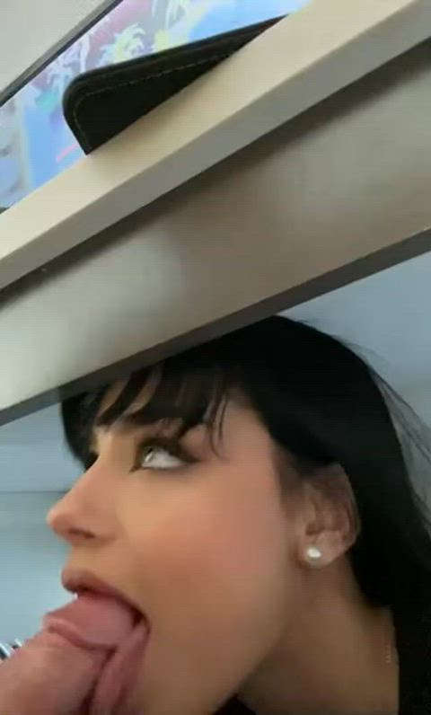 Doing her best to swallow his cock whole