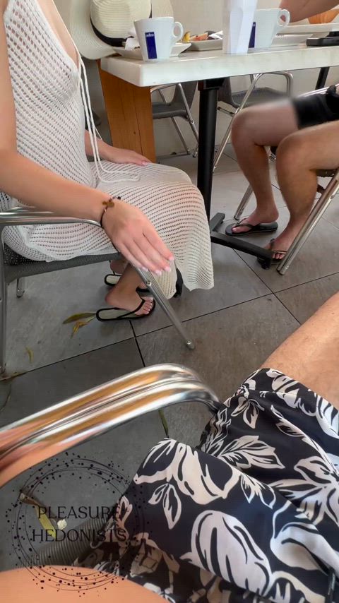 A sneaky cock grab in front of her husband