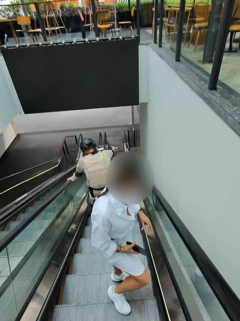 Sexy grandma flashing tits behind security guy at the mall