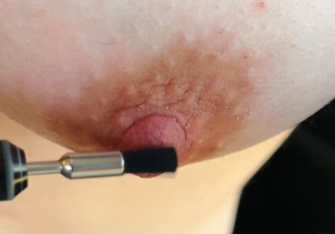 torturing my poor sensitive nipple with an electric brush