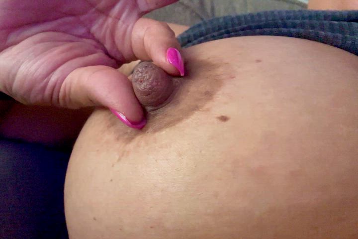 Playing with my big brown milky nipples 🤎