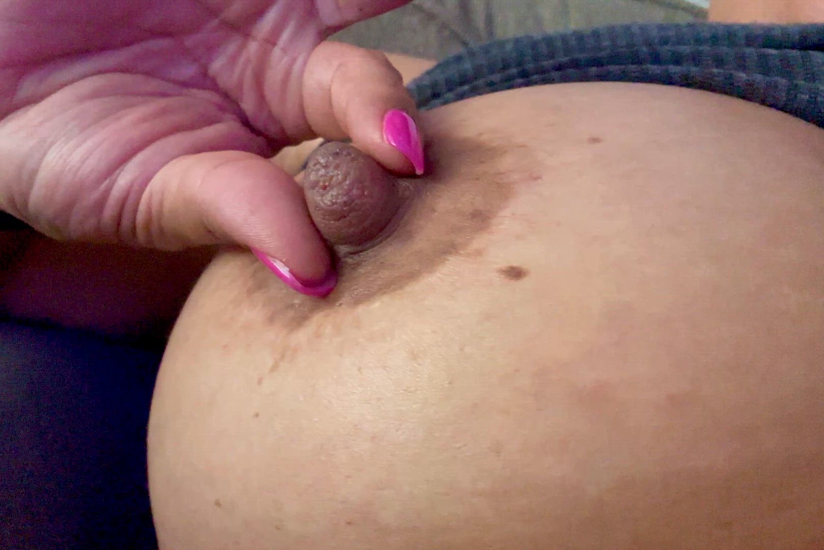Playing with my big brown milky nipples 🤎
