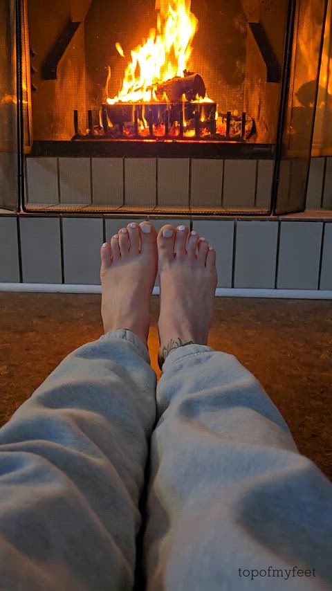 Warming my white toes by the fire