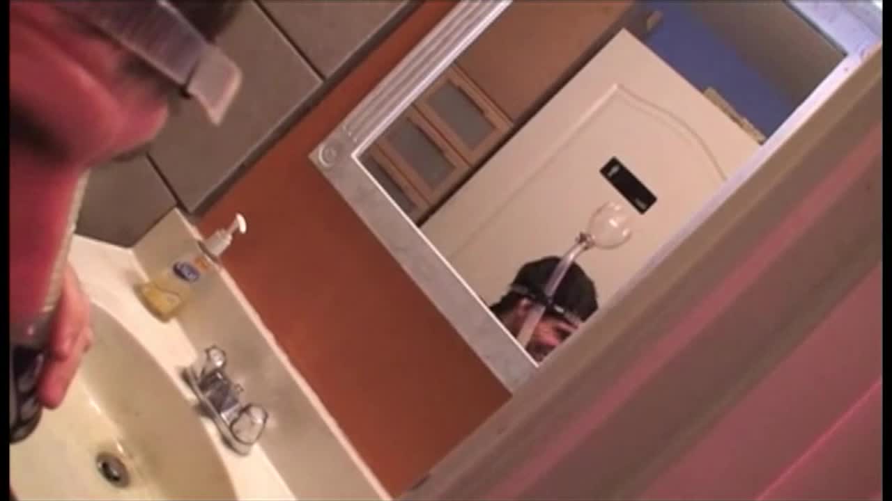 Whore being fitted for a Cum-Bong prior to her bukkake with a room full of sweaty perverts