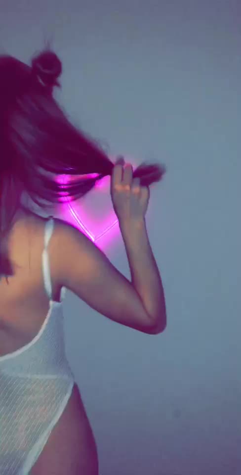 Petite in white, neon light.