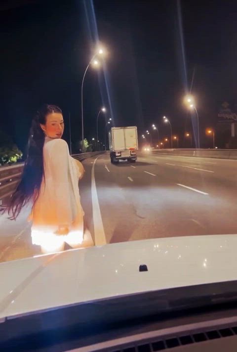 In the city, complaining to cars with my tits