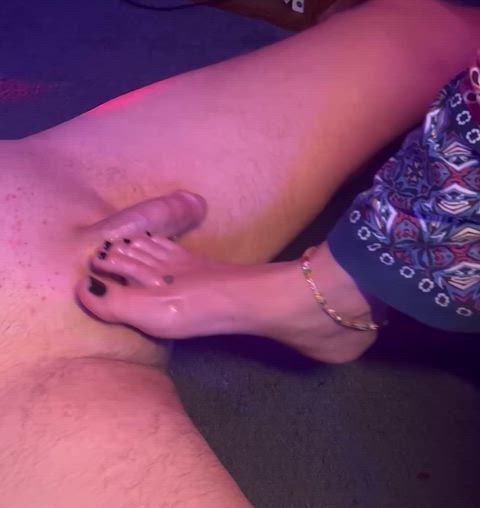 Sexy MILF foot rubbing oiled up cock and balls