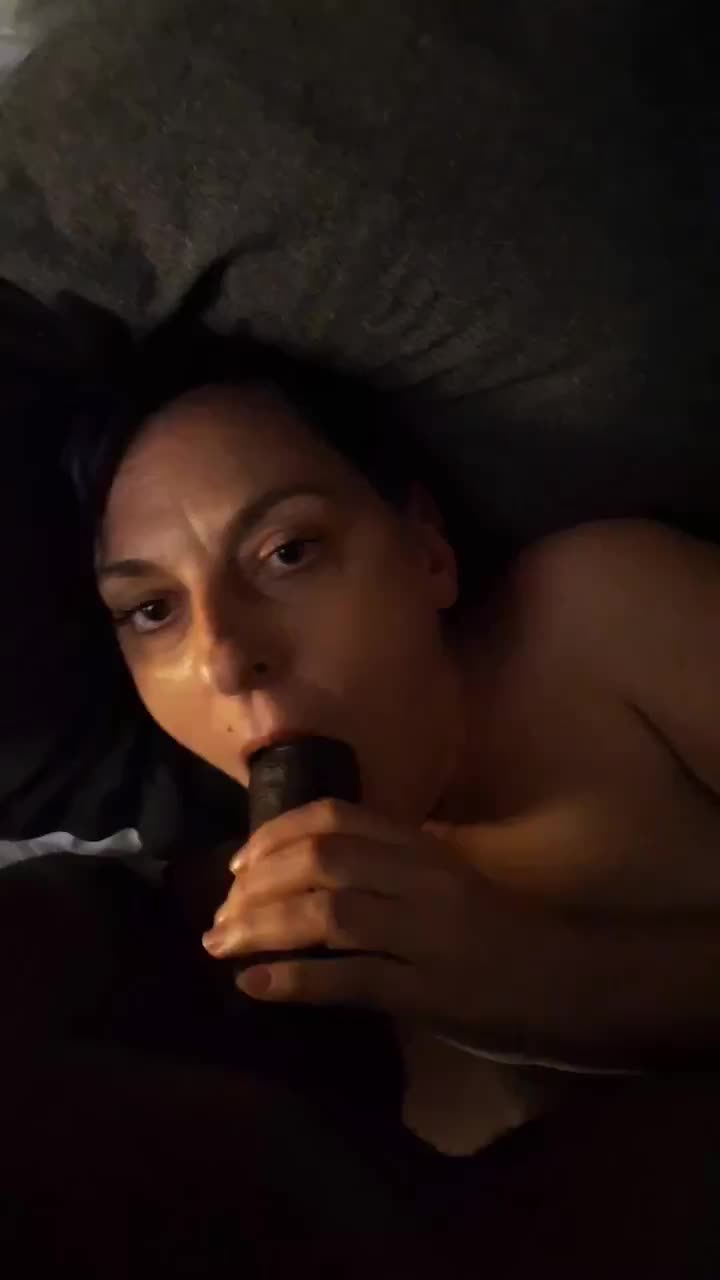 Sucking on a long black cock