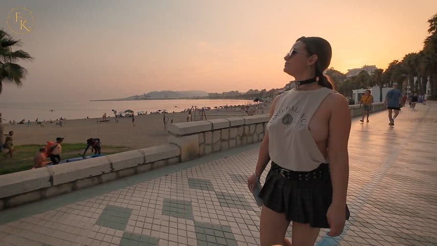 Enjoying the walk along the beach in a light sideboob top and nippleclamps.