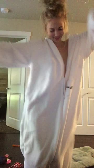 Blonde in onesie showing off