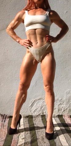 Lean, all-natural, and impressively sculpted, with biceps, defined abs, and calves carved to perfection, radiating unstoppable strength.