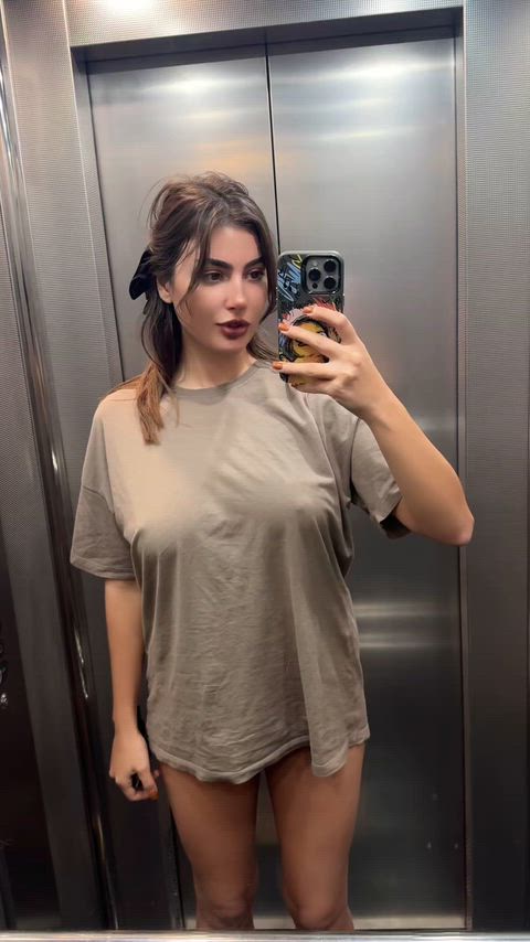 College doll waiting for his neighbor in the elevator