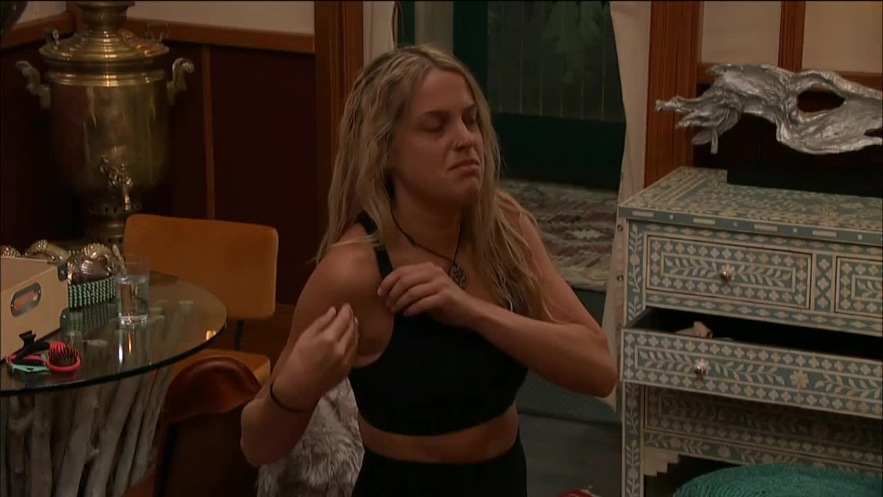 Christie nipslp showing pierced nipple adjusting top (credit svwulfer) GIF