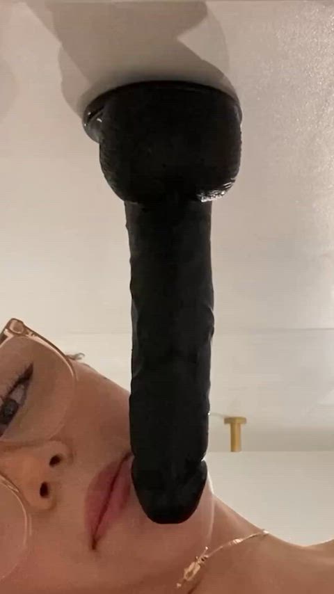 Takes on huge dildo.