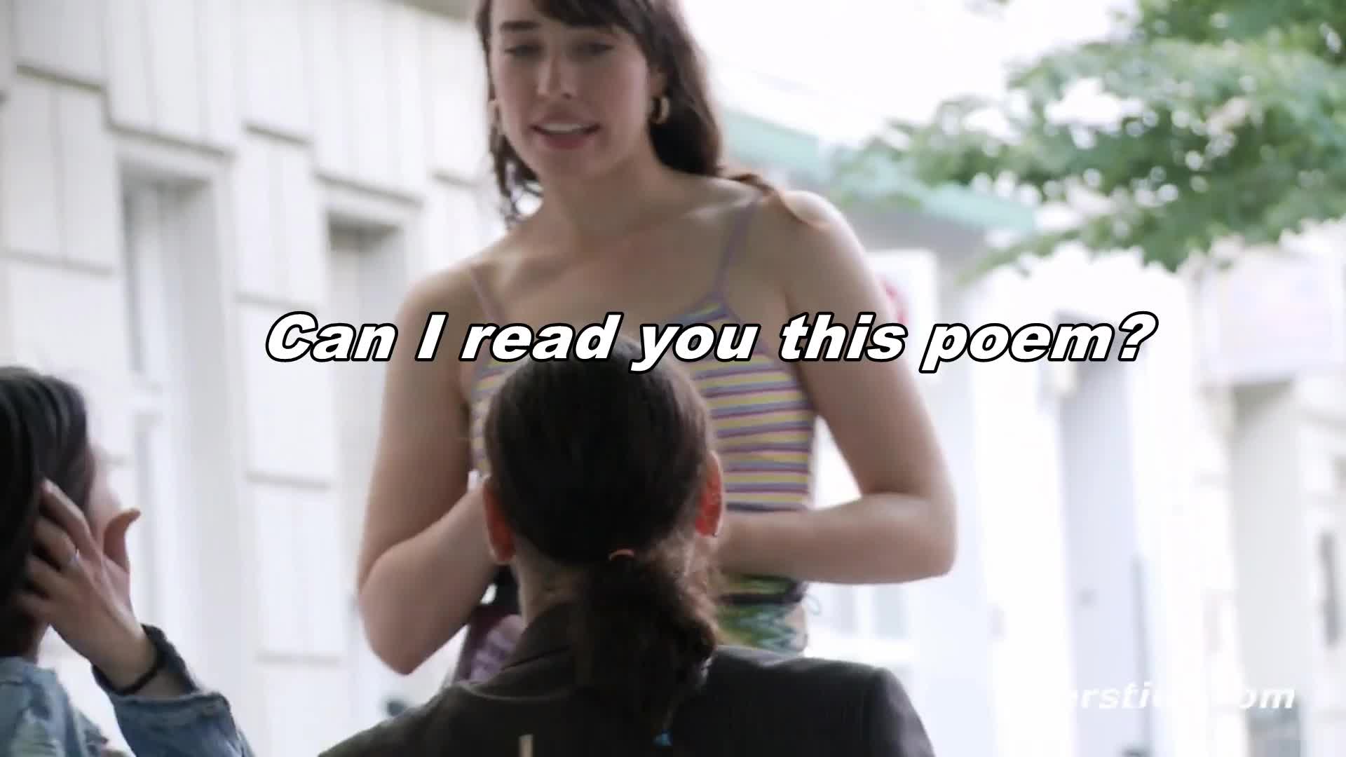 Reading a poem with a remote controlled vibrator inside her.