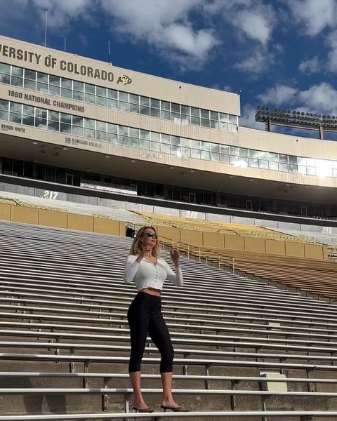 Penny Lane giving those shirt buttons some trouble