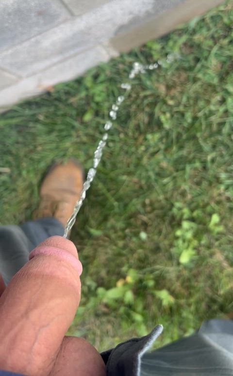 Shaking the last bits of piss out of my soft cock