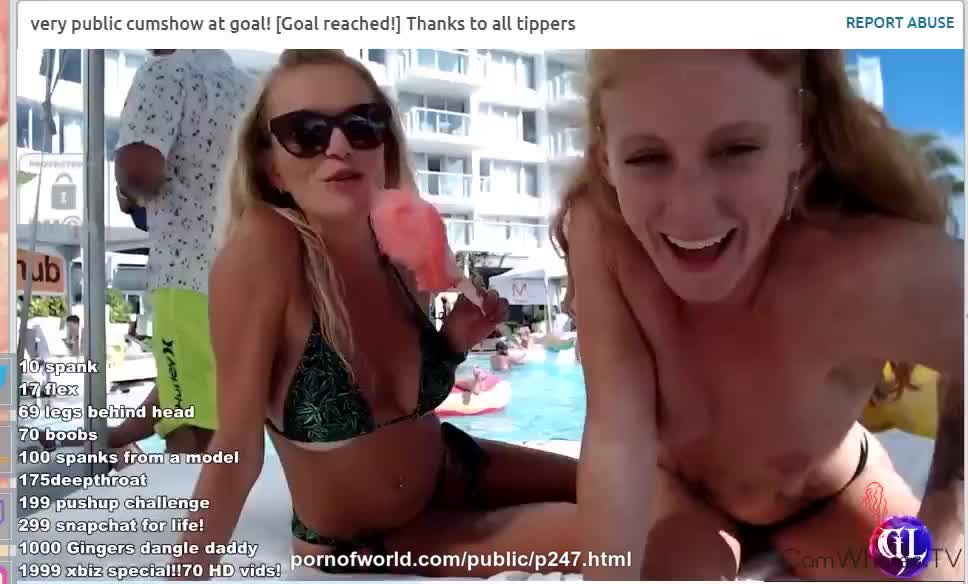 Two blondes by the pool in front of a webcam masturbate with naked boobs