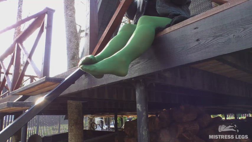 I'm teasing you with my feet in green pantyhose on the porch
