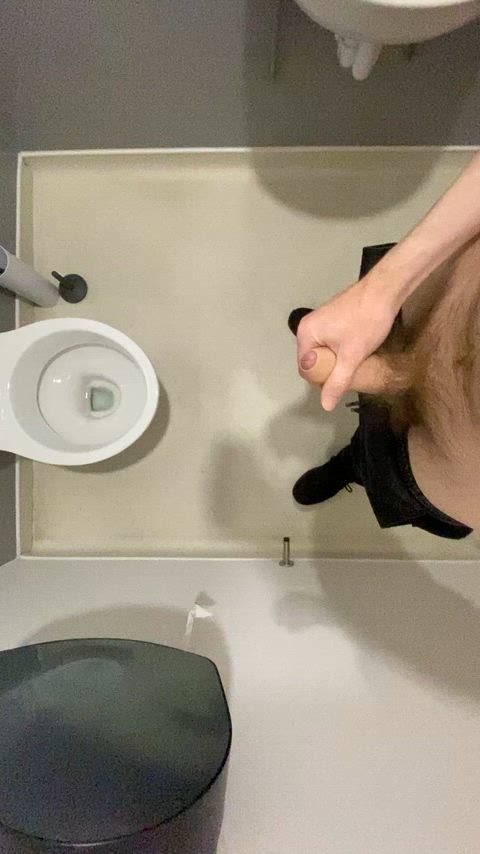 Pissing in a public bathroom