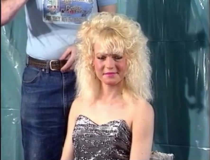 Blonde woman gets honey and rice pudding in her hair