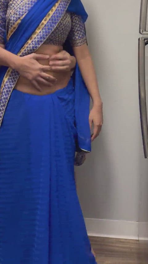 Indian bhabhi exposing navel and stripped in saree