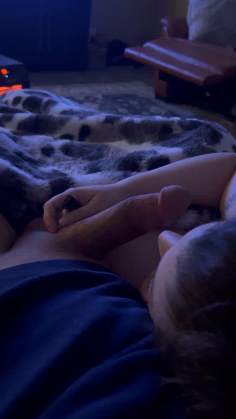 Holding it in her mouth while we watch tv